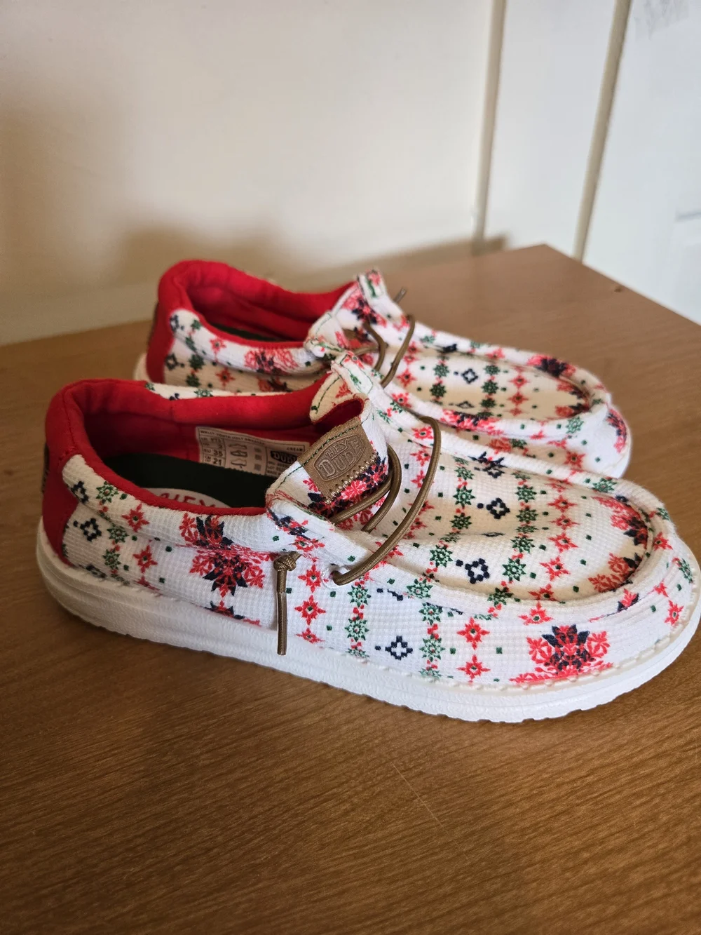 Hey Dude Kids White Slip-On Sneakers with Red and Green Pattern